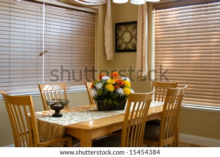 Vacation cabin dinning room; flowers; windows closed; Interior decor.