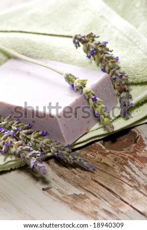 Spa set - fresh lavender and organic lavender soap over old wooden tray. best suited for relaxing and health commercials