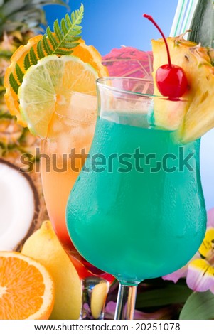 Closeup of Mai Tai and Blue Hawaiian cocktails surrounded by tropical fruits. Most popular cocktails series.