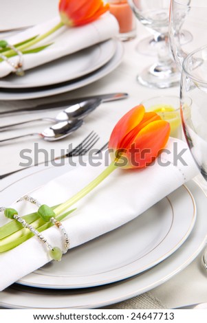 stock photo Fine food and wine spring table settings with fresh tulips