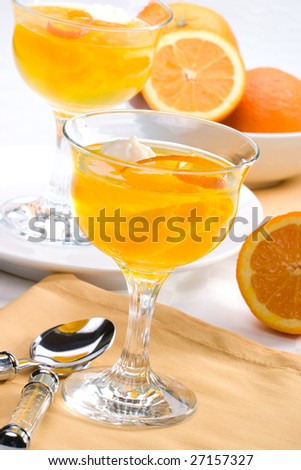Delicious Champagne Orange jelly served with whipped cream and orange zest