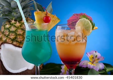 Closeup of Mai Tai and Blue Hawaiian cocktails surrounded by tropical fruits. Most popular cocktails series.