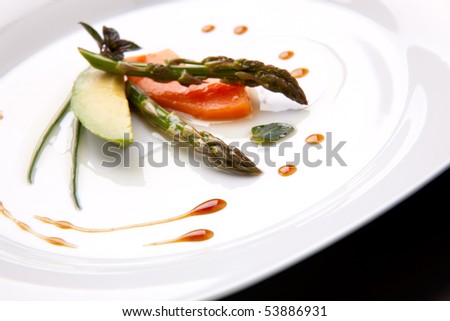 Closeup of Tapas Salad appetizer with avocado, asparagus, papaya, chocolate mint and chives.