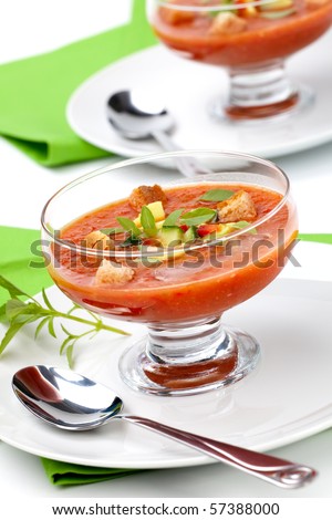 Two bowls of delicious cold Gazpacho soup with cucumber - avocado salsa. Good summer time appetizer.