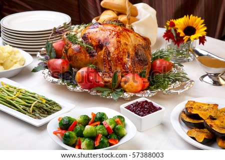 Delicious roasted turkey with savory vegetable side dishes in a fall theme