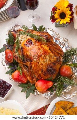 Delicious roasted turkey with savory vegetable side dishes in a fall theme