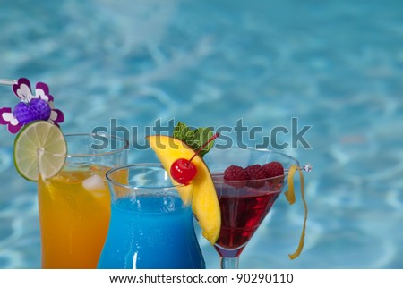 Mai Tai, Blue Hawaiian, and Cosmopolitan cocktails on swimming pool side