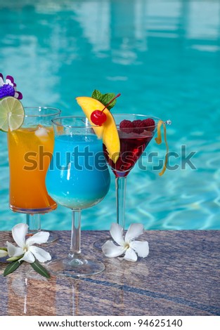 Mai Tai, Blue Hawaiian, and Cosmopolitan cocktails on swimming pool side