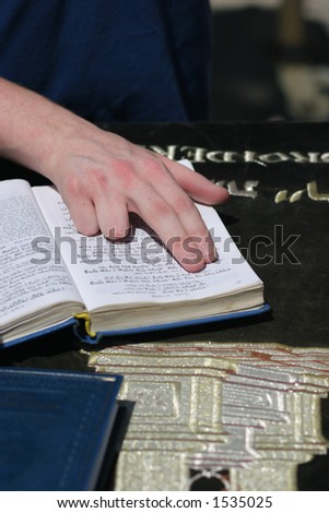 Young man reads from the Torah during his Bar Mitzvah at the western Wall.Jerusalem,Israel