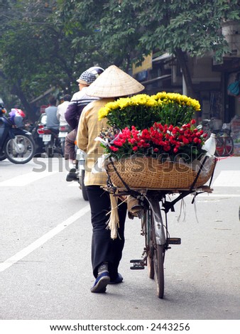 Flower seller on Bicycle in Hanoi Vietnam