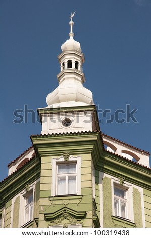 Empire style house with a white tower