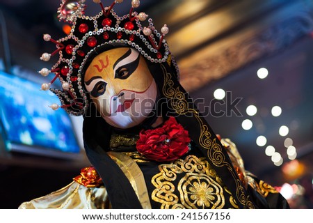 Chengdu - December 29 2014: Chinese artist perform traditional face-changing art or bianlian onstage at Chunxifang Chunxilu on December 29, 2014 in Chengdu, Sichuan Province in China