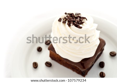 Chocolate cake dessert with coffee and whipped cream