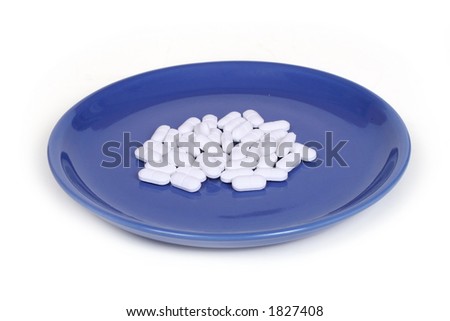 white pills on a blue plate