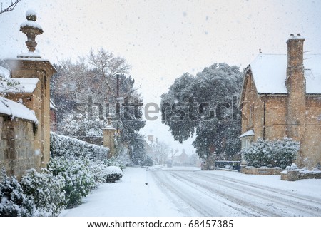 Cotswold village in snow, Gloucestershire, England.