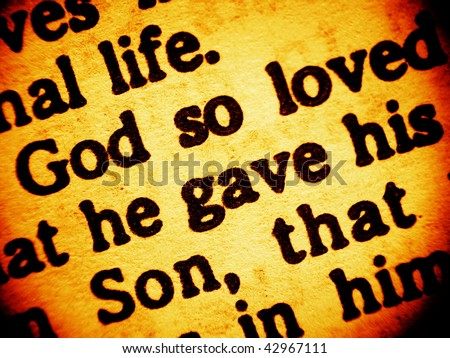 Close up view on a part of biblical text from the Bible, the Gospel of John chapter 3, verse 16, focusing on the words: God so loved - he gave his Son. (Bible in Macro series)