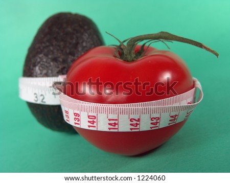 Big Red Tomato, Avocado and Measuring Tape Representing Dieting and Fitness (Close-up with life-like colors)