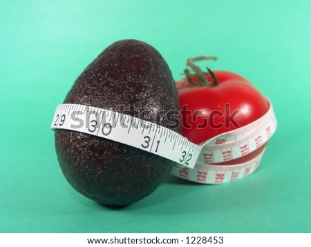 Big Red Tomato, Avocado and Measuring Tape Representing Dieting and Fitness (Close-up with life-like colors)