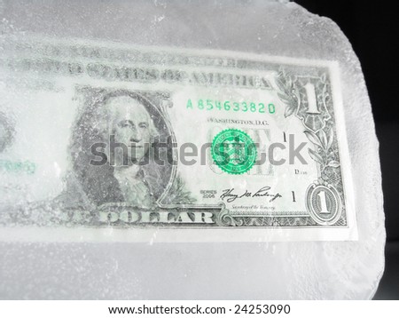 US paper currency (one dollar) frozen in ice representing a downsizing economy, financial crisis, unemployment and investment lose