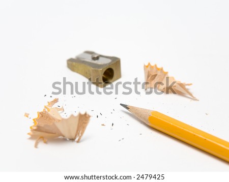 Pencil, sharpener and shavings on a white background