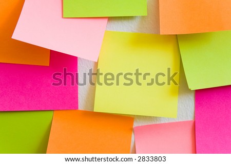 Blank sticky notes attached to a white wall