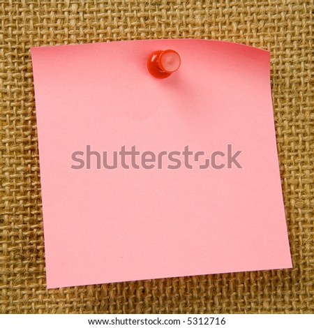 Sticky note attached to bulletinboard
