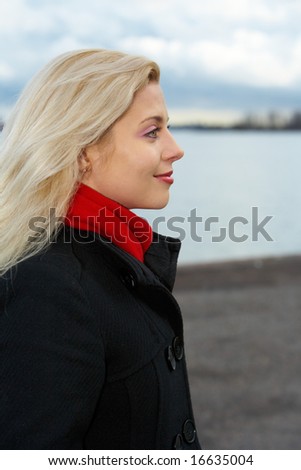 Young woman contemplating outdoors, side profile