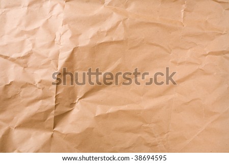 Creased brown packaging paper sheet texture background