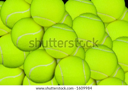 Explosion of tennis balls piled up and captured in high detail. A background for tennis lovers.