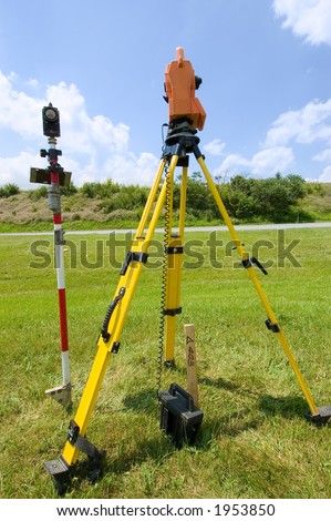 Complete land surveying station. A tripod, an electronic distance meter, and a prism mounted atop a rod for relaying electronic signals to the meter. Battery pack is connected to the meter.