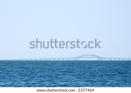 View across Great South Bay, Long Island, NY of one of several bridges that connect the island to the beaches on the Atlantic Ocean.