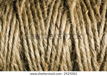 Macro / close-up image of a roll of twine string used in recycling. Fibrous rope shows much detail.