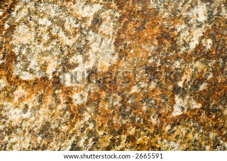 Real Brazilian granite providing rich, warm, golden earth tones and texture in high detail. Perfect for a texture or abstract background.