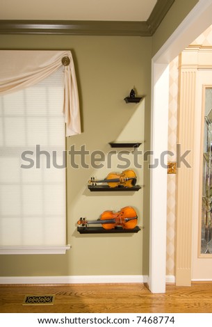 Modern and stylish home interior design showcasing a collection of violins.