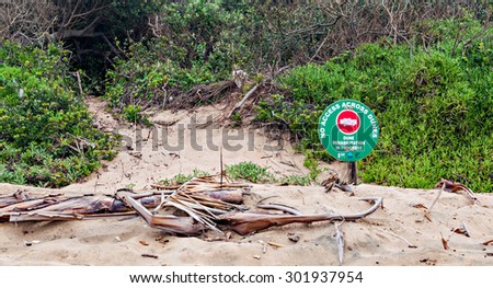 DURBAN, SOUTH AFRICA - JANUARY 20, 2015: No Access Across Dunes Sign on the beach at Umhlanga Rocks