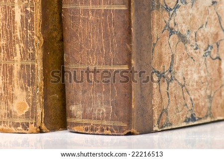 Old antique leather books. Close up on spine with shallow focus.