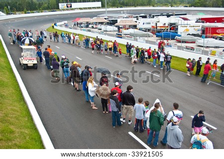 ANTIGONISH, NOVA SCOTIA - JULY 18: Maritime Pro Stock Tour action during the IWK 250 race, July 18, 2009 in Antigonish, Nova Scotia. Here fans line up for an autograph session with the drivers.