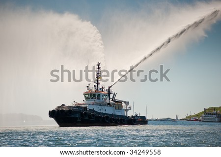 HALIFAX, NOVA SCOTIA - JULY 20: A fire boat pumps water in celebration during the Tall Ships Nova Scotia festival, July 20, 2009 in Halifax.
