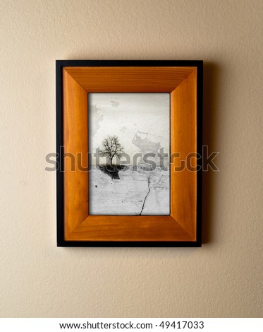 Unique lone tree art work in a beautiful wooden frame. Interior decor element with original artwork.