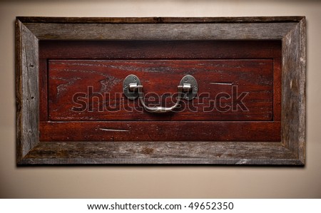 Wooden dresser drawer image in a worn and weathered wooden picture frame. Handmade woodworking concept.