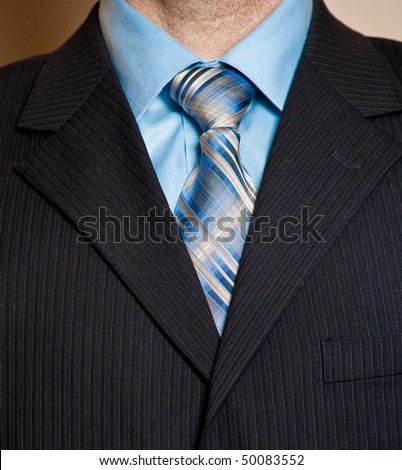striped tie with a striped shirt. Blue shirt, striped