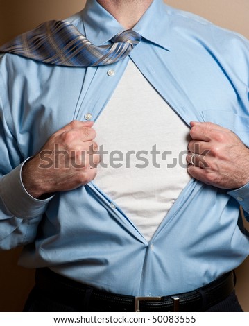 Business man in blue dress shirt and tie opens shirt to reveal blank white undershirt. Blank area suitable for your logo or text.