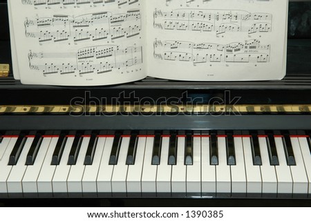 piano keys with music sheet