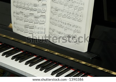 piano keys with music sheet