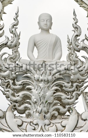 Buddha statue at Wat Rongkun - the white temple in Chiangrai , Thailand .