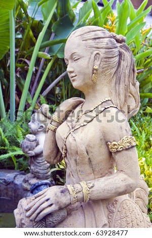 stock photo molded woman Thai figure in the flower garden