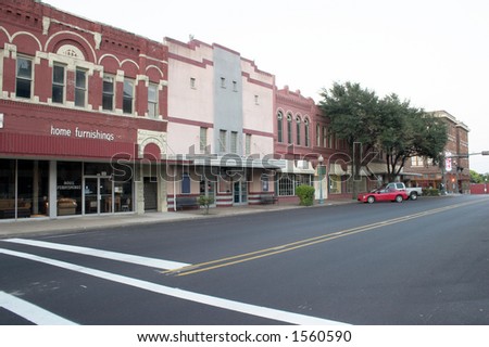 Typical downtown main street complete with furniture store and movie theater that could be almost any town in the Mid West United States.