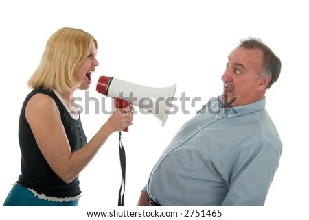 stock photo : Extreme domestic argument with wife shouting commands through a megaphone at her fearful husband.