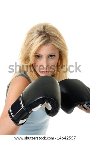 Beautiful blonde woman with black boxing gloves on a white background.