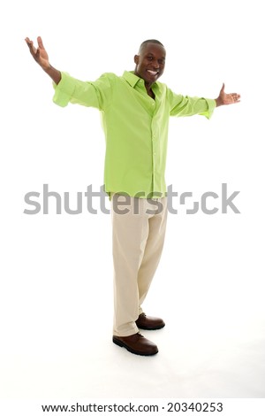 stock photo : Casual young African American man standing in a bright green shirt with a welcoming hands apart gesture.